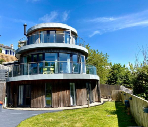 One of the best properties in Lyme! Breathtaking views across the whole bay. 3 stories with 2 tier veranda around the property. Sleeps 6